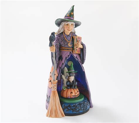 Rotating witch statuette